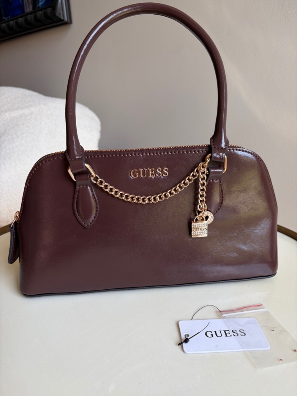GUESS Dark Walnut Leather Penny Satchel with Gold Chain Charm